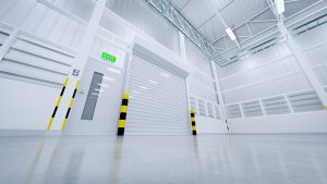A clean, modern, industrial facility with a white commercial garage door