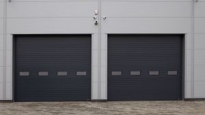 Two black mini warehouse garage doors