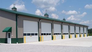 Warehouse with a series of white commercial garage doors